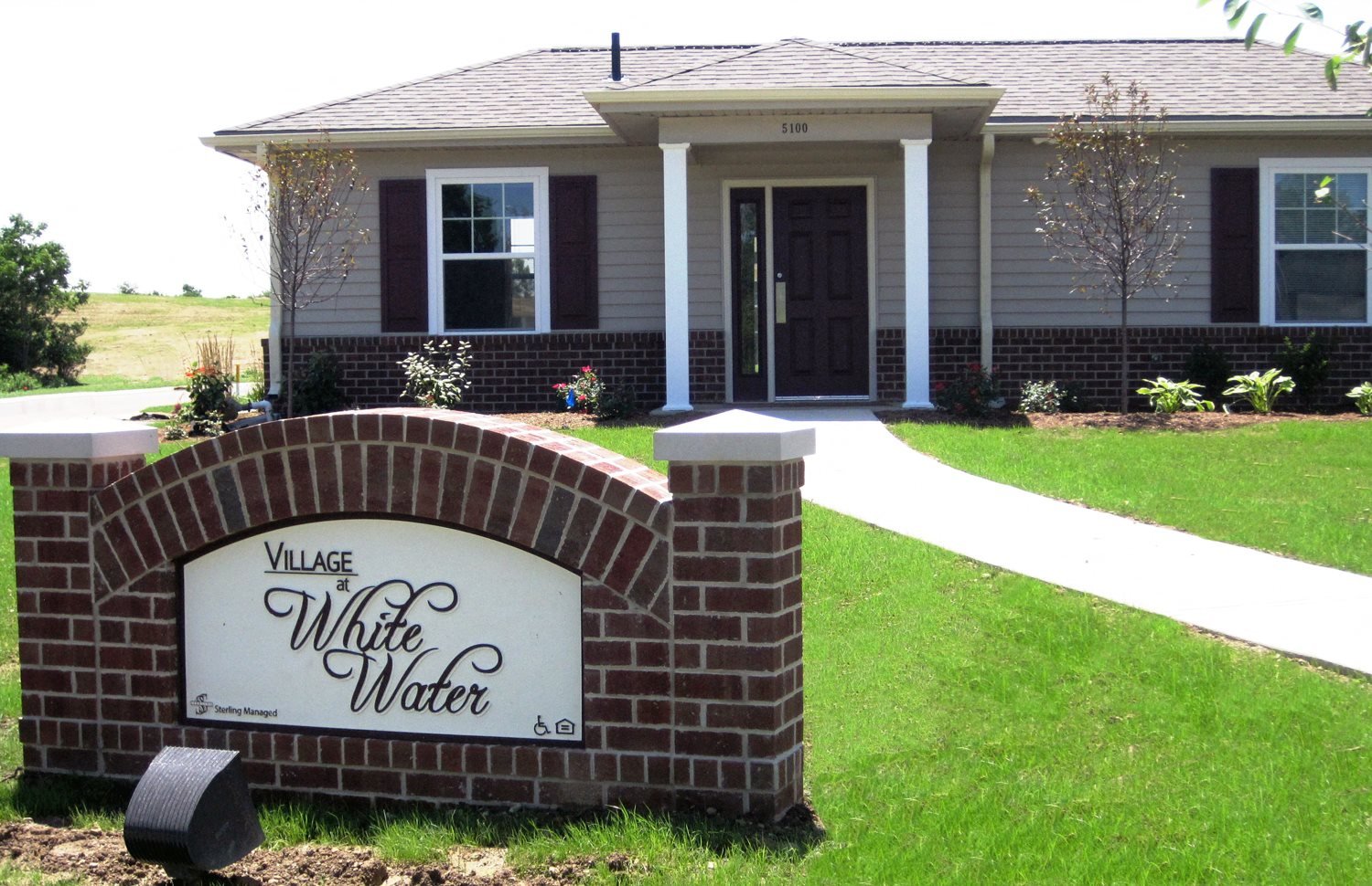 Entrance sign of Village at Whitewater Apartments